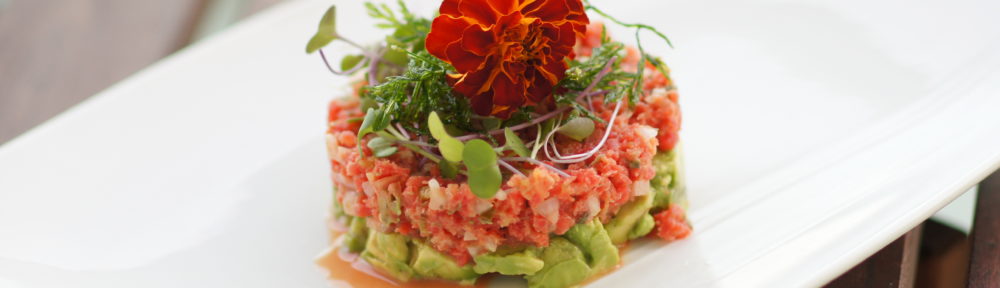 Carrot Tartare with Microgreens, Fried Carrot Tops, and Edible Flowers